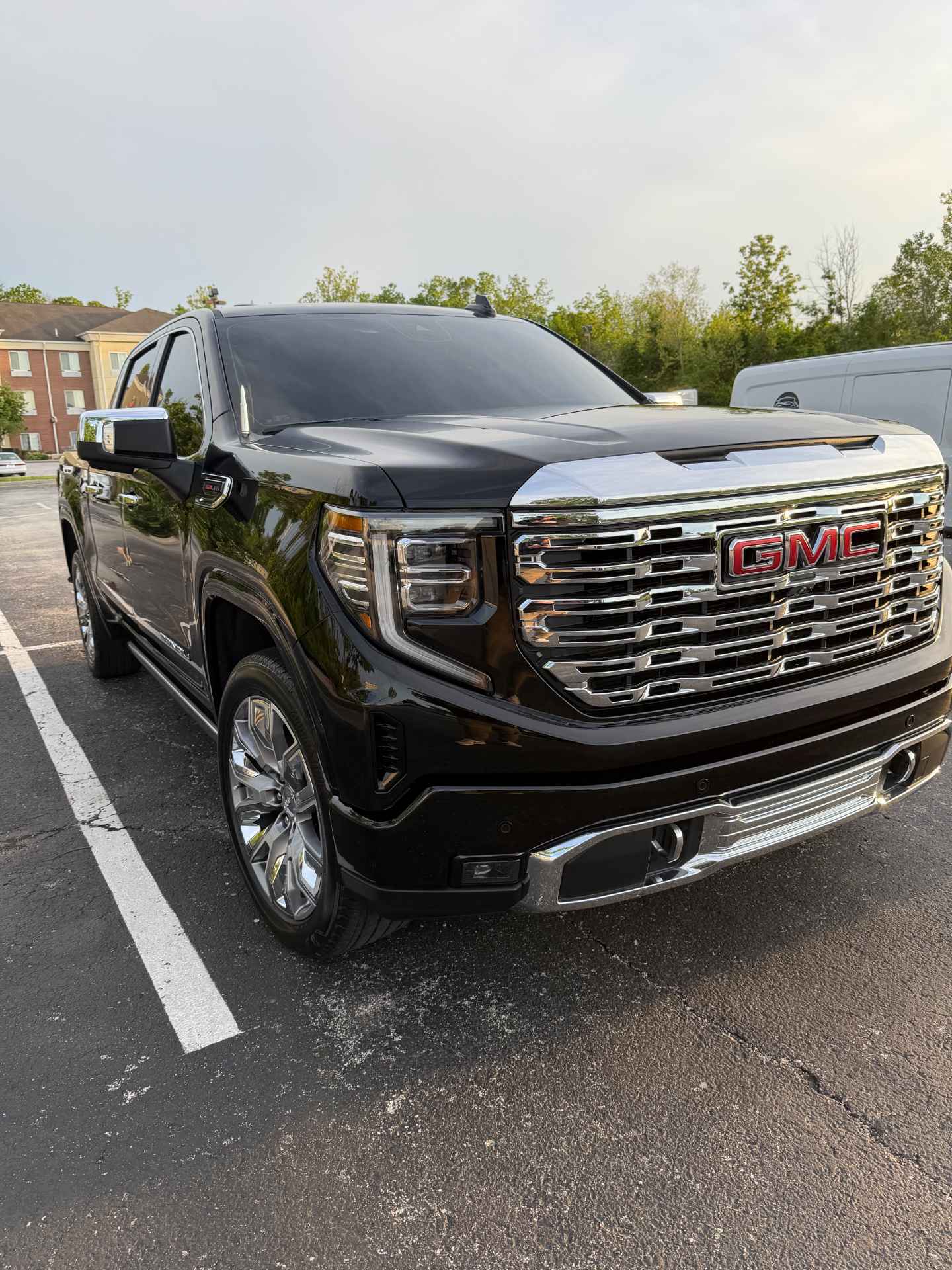 Black GMC truck with a mirror-gloss finish after detailing