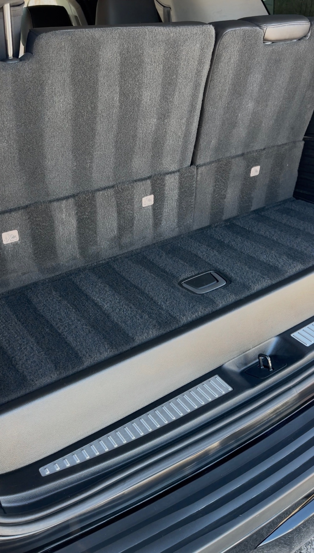 SUV cargo area carpet vacuumed with crisp clean lines