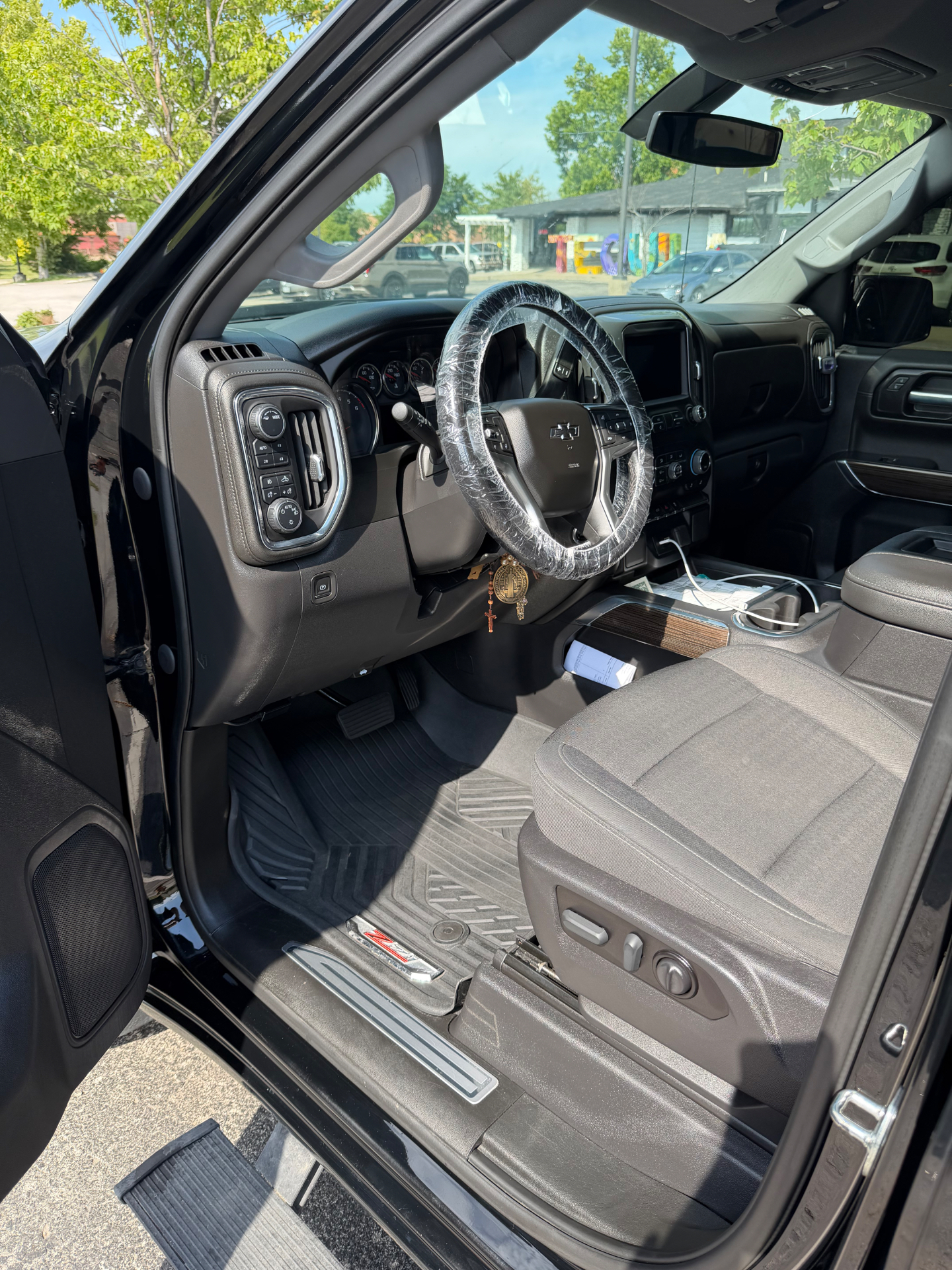 Chevrolet Silverado interior with spotless dash, cloth seats and floor liners