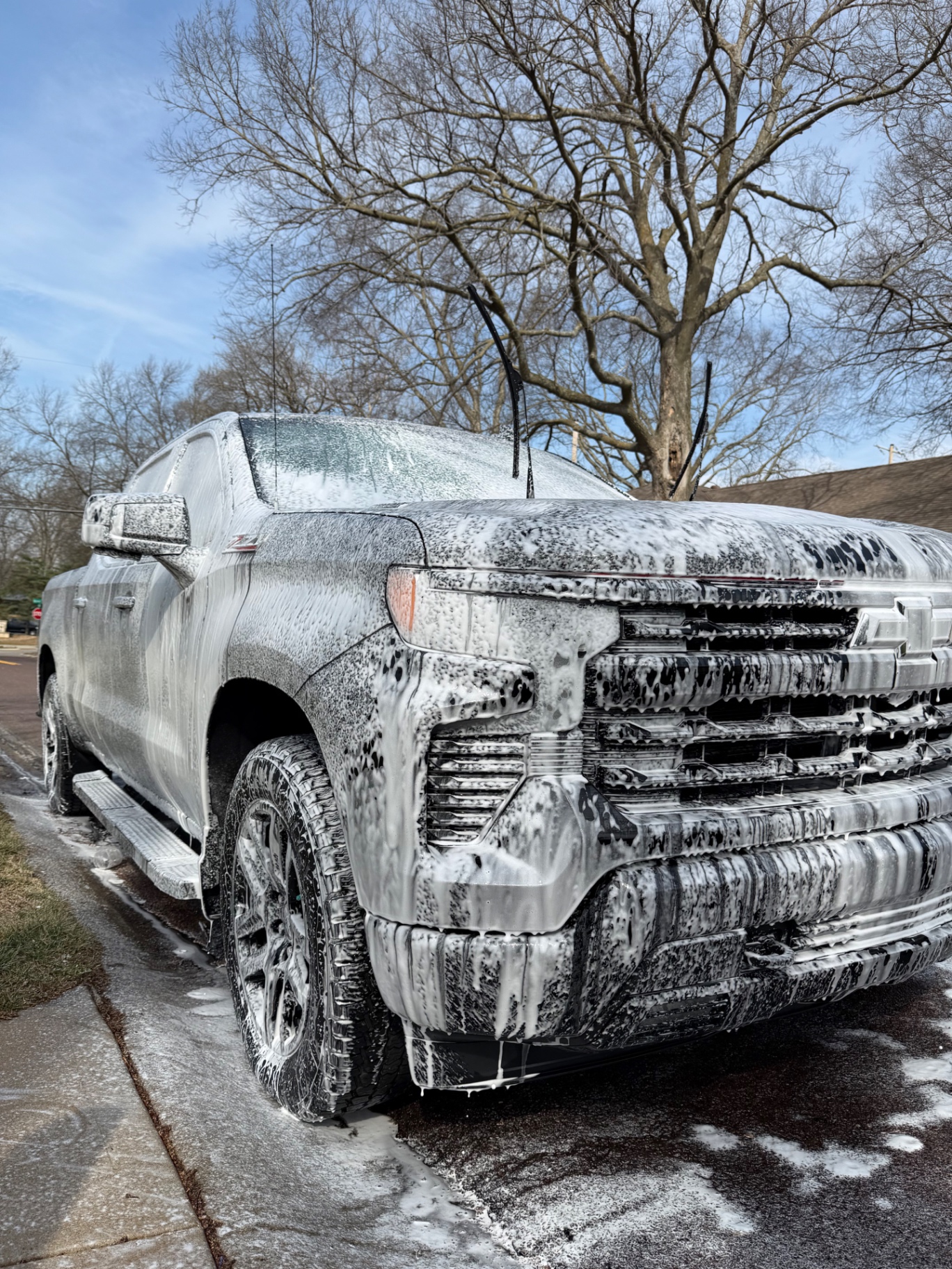 Chevrolet Silverado Z71 covered in thick foam during an exterior wash