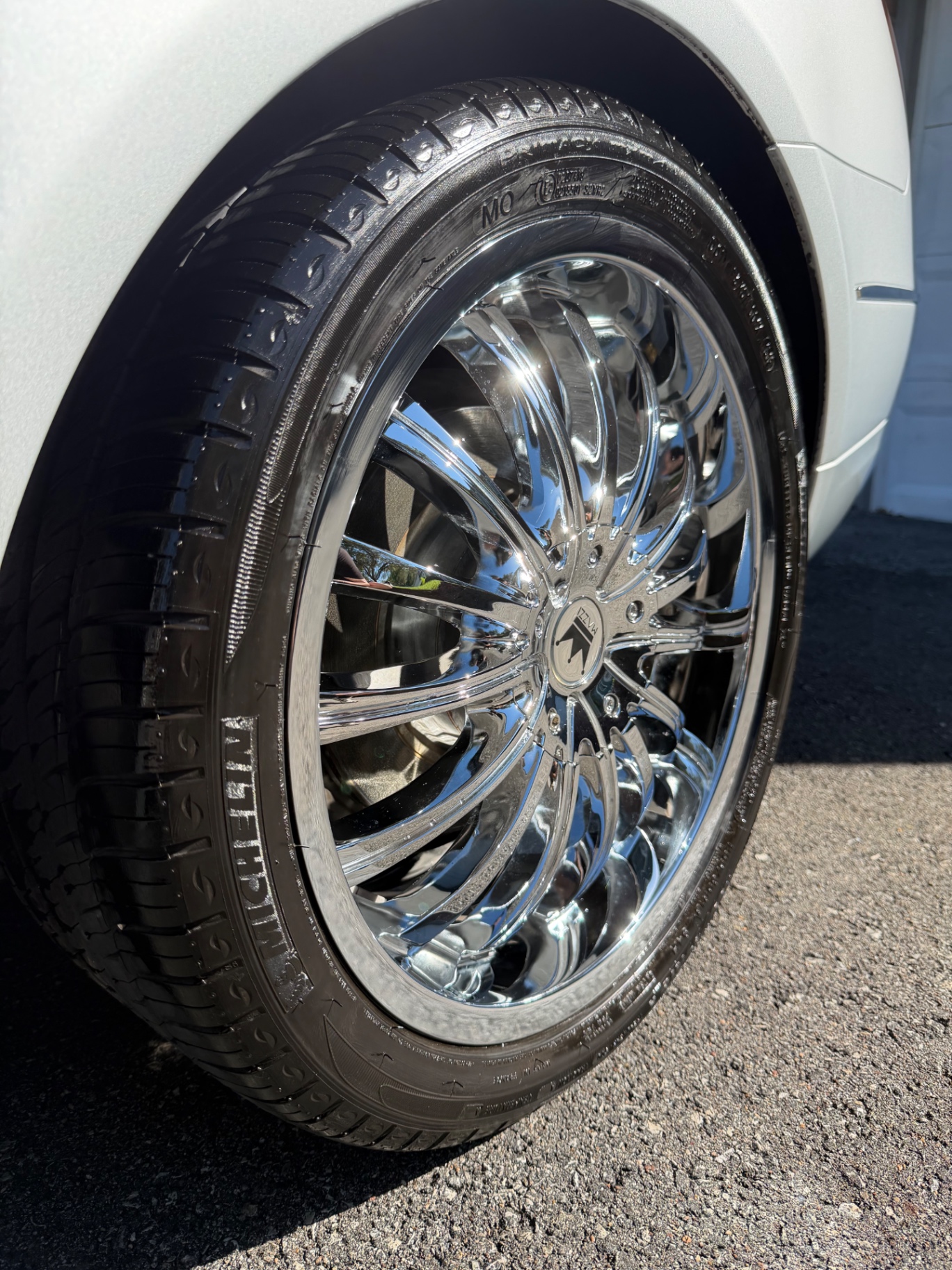 Polished chrome wheel and dressed tire after a deep wheel and tire clean