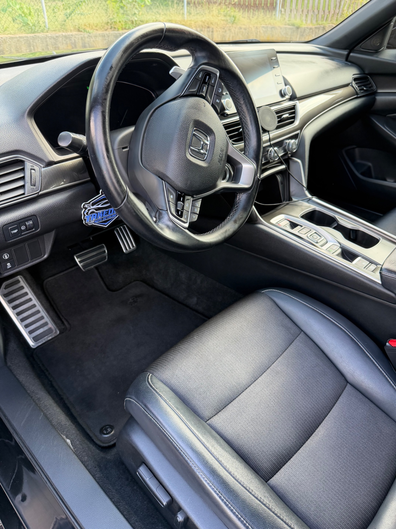Honda Accord interior vacuumed and wiped down with clean carpets and console